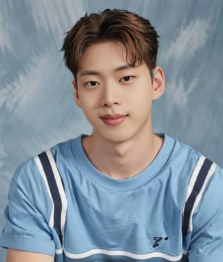 Man in a blue shirt posing for a photo is the new face of the boy group.