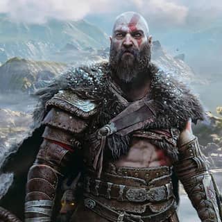 God of War Kratos standing in front of mountains