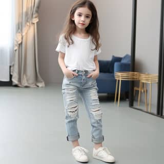 fashionable cute jeans for kids girls, a little girl wearing ripped jeans and white t - shirt