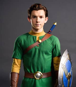 in a green and yellow costume holding a shield