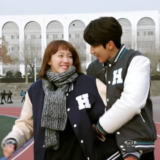 a couple is standing on a basketball court